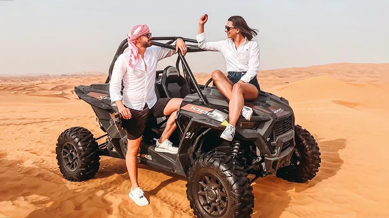 dune buggy couple sunny days